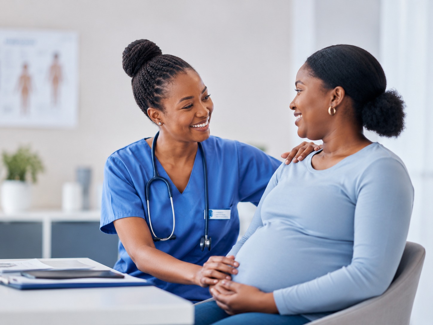 Nurse supporting an expectant mother during a maternity visit