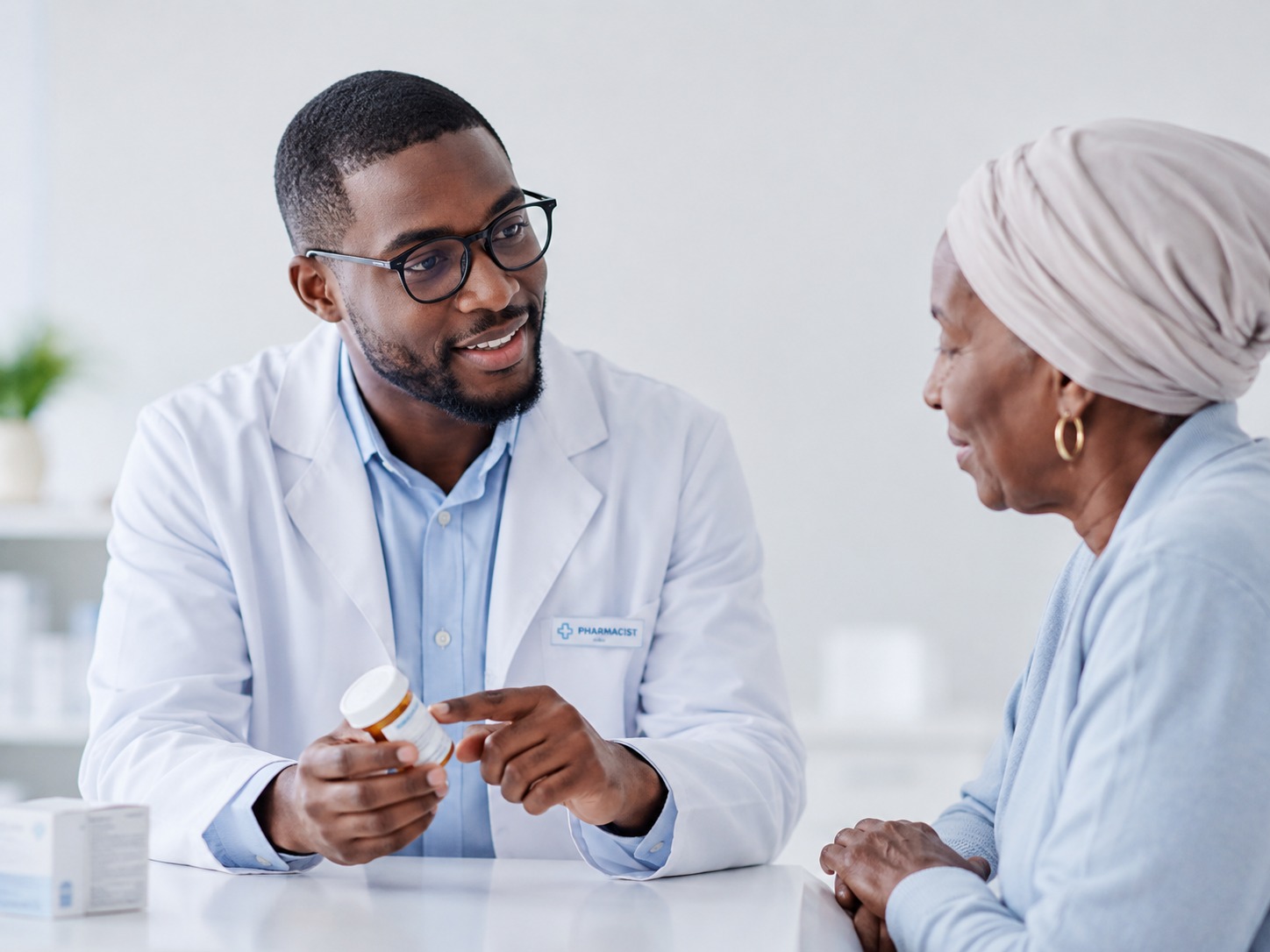 Pharmacist explaining medication to a patient